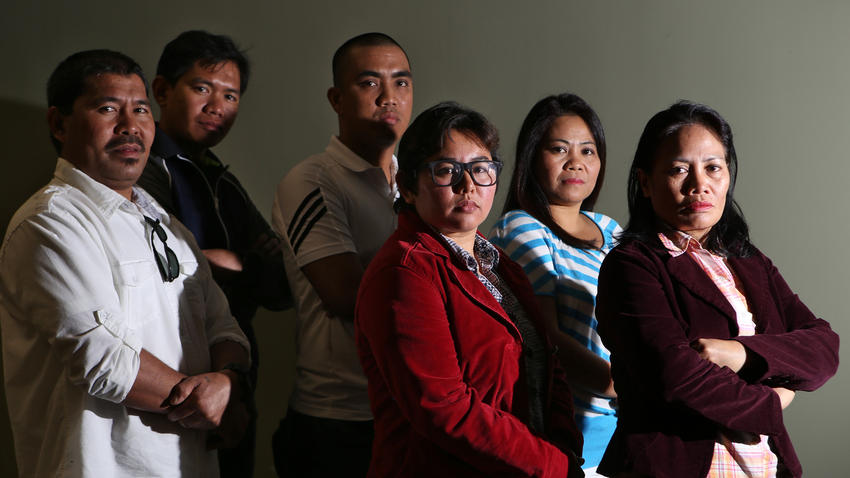 Eleven Filipino bakery workers who have sued L'Amande French Bakery alleging labor exploitation include, from left, Fernan Belidhon, Elmer Genito, Romar Cunanan, Louise Luis, Gina Pablo and Ermita Alabado. (Irfan Khan / Los Angeles Times)